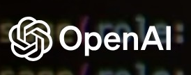 OpenAI logo on the 2023 openai.com homepage: The wordmark returns beside the blossom.
