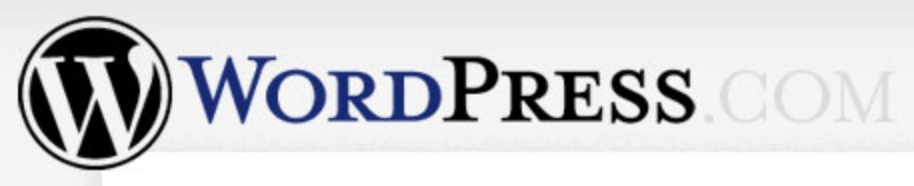 WordPress.com logo on the 2005 wordpress.com homepage: Black W emblem with a blue and black serif wordmark.